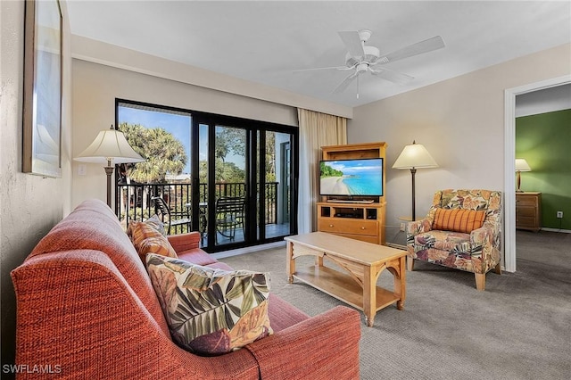 living room featuring carpet flooring and ceiling fan