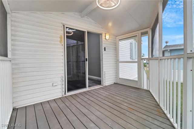 unfurnished sunroom with vaulted ceiling and a healthy amount of sunlight