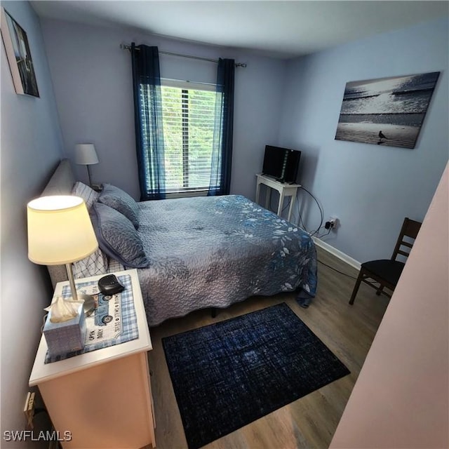 bedroom with wood-type flooring