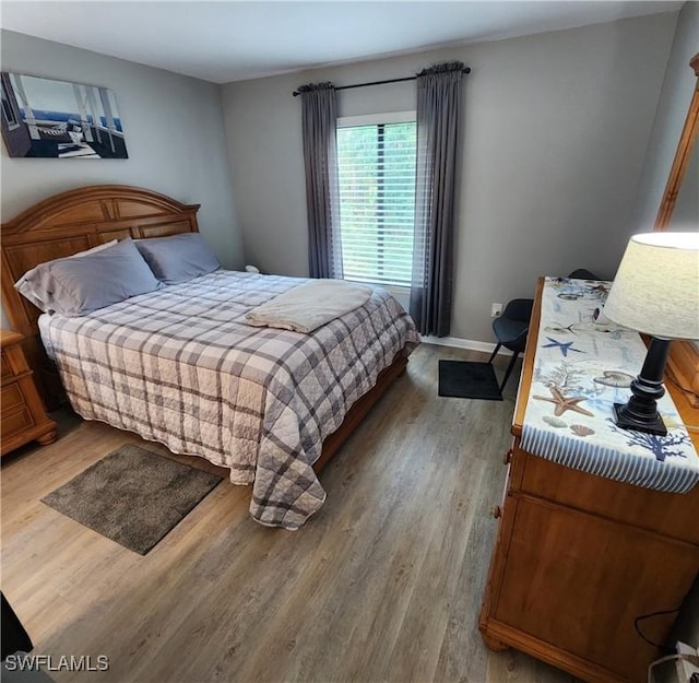 bedroom with wood-type flooring