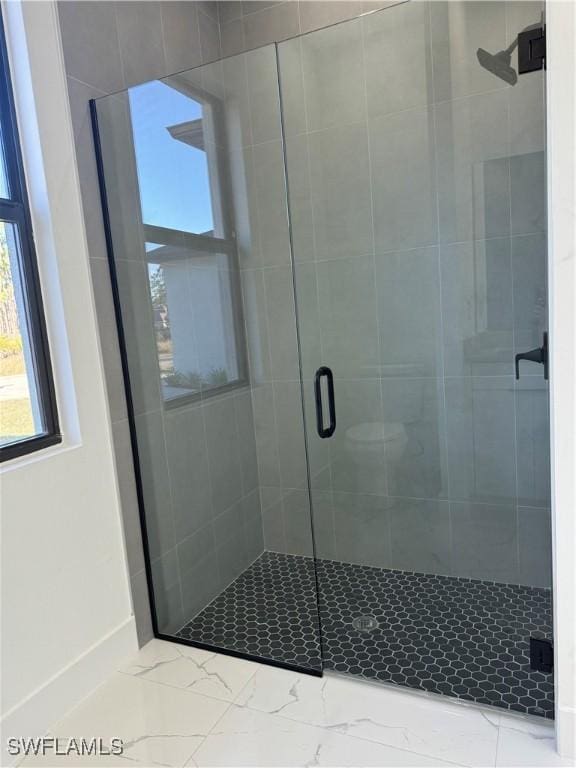 bathroom with an enclosed shower