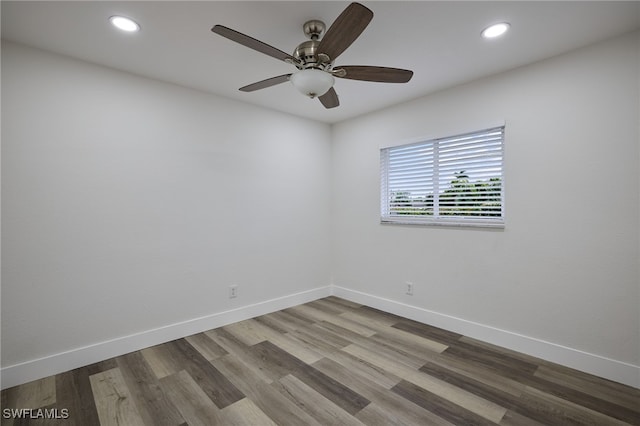 empty room with wood-type flooring and ceiling fan