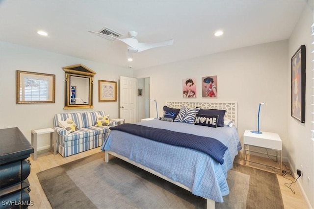 bedroom with ceiling fan and wood-type flooring