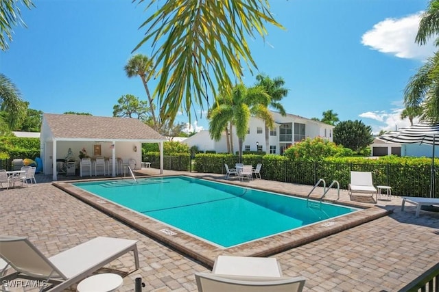 view of swimming pool featuring a patio