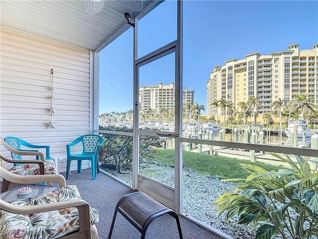 sunroom / solarium with a water view