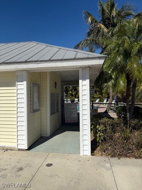 property entrance with a carport