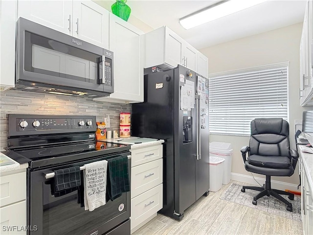 kitchen with black range with electric cooktop, backsplash, white cabinets, and stainless steel refrigerator with ice dispenser