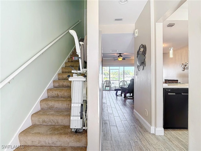 stairway with ceiling fan