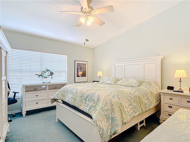 bedroom with dark colored carpet and ceiling fan