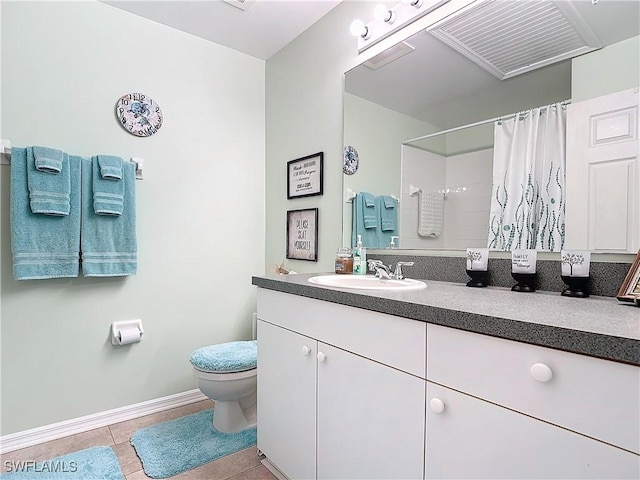 bathroom featuring a shower with shower curtain, vanity, toilet, and tile patterned flooring