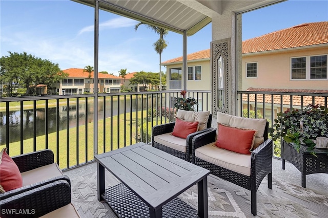 balcony featuring a water view