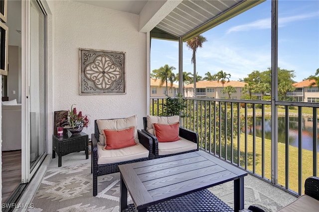 balcony featuring a water view