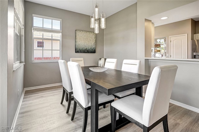 dining space with light wood-type flooring