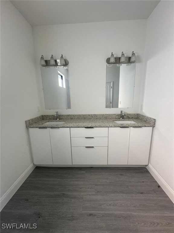 bathroom featuring hardwood / wood-style floors and vanity