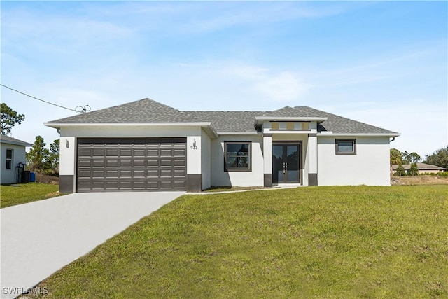 view of front of home featuring a garage and a front yard