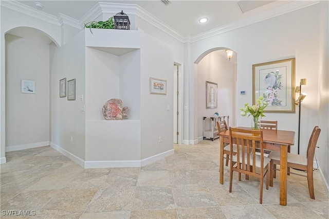 dining room featuring ornamental molding