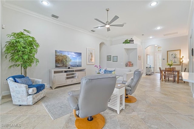 living room with ceiling fan and crown molding