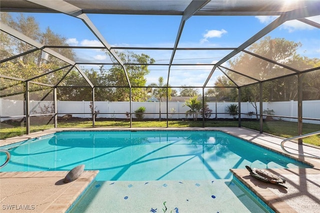 view of swimming pool with a lanai and a patio area