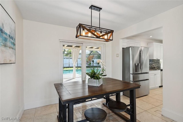 dining area featuring light tile patterned floors