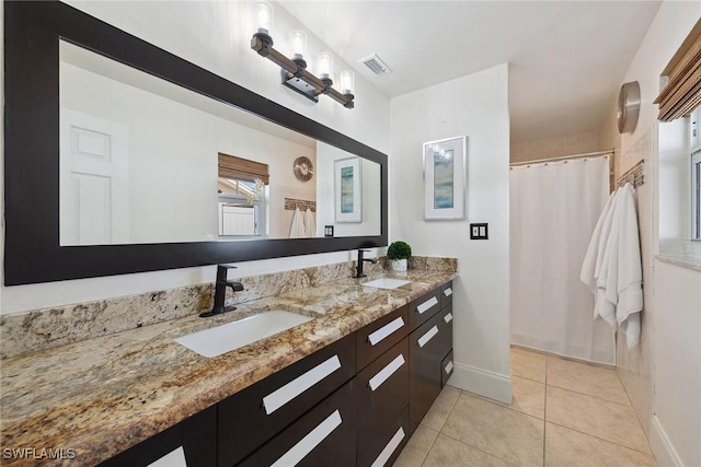 bathroom featuring vanity, tile patterned floors, and a shower with curtain