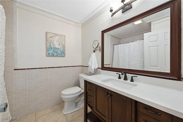 bathroom featuring tile walls, tile patterned flooring, vanity, ornamental molding, and toilet