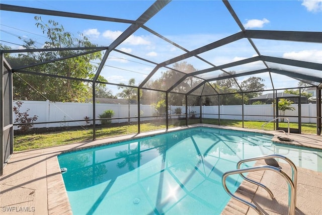 view of pool with a lanai and a patio