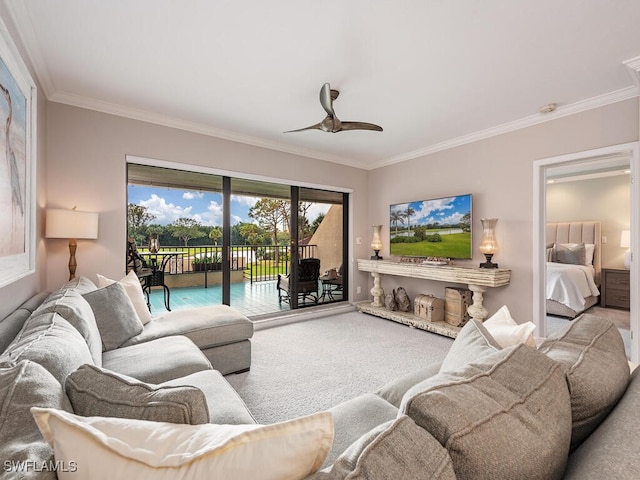 carpeted living room featuring ceiling fan and ornamental molding