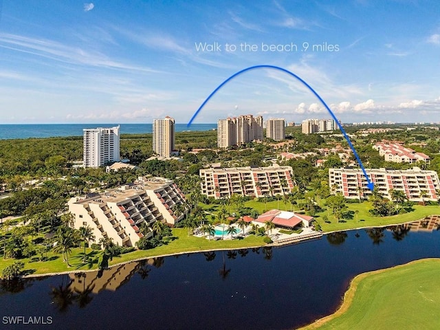 aerial view featuring a water view and a city view