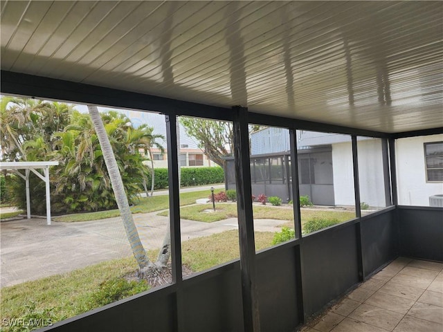 unfurnished sunroom with plenty of natural light