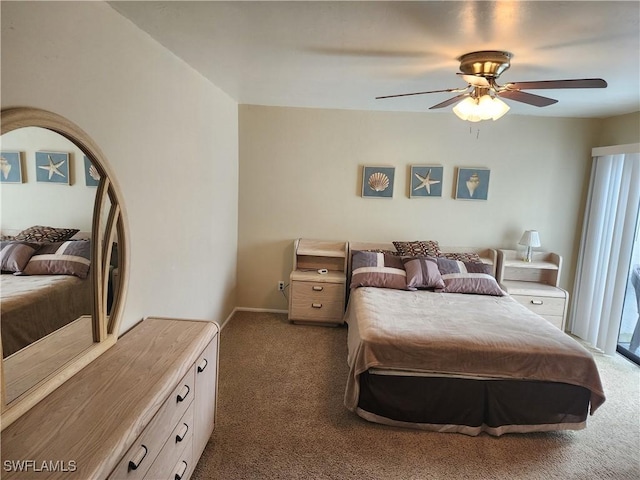 bedroom featuring ceiling fan and dark carpet