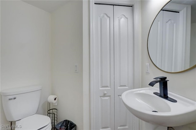 bathroom with sink and toilet