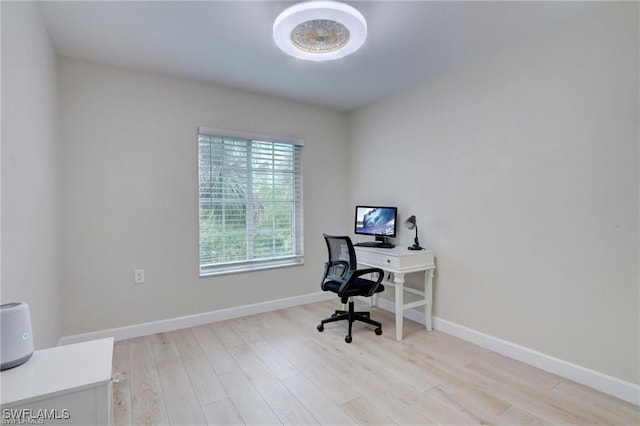 office with light hardwood / wood-style flooring