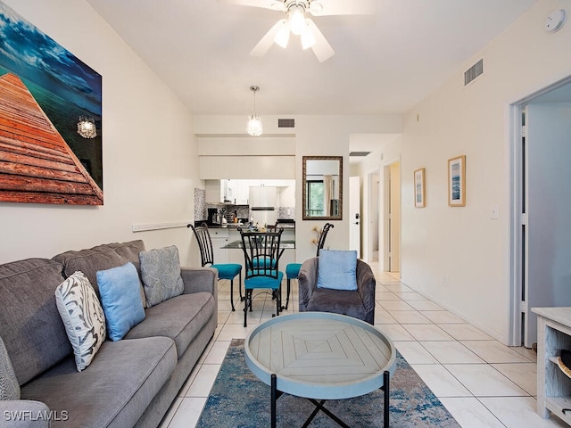 living room featuring ceiling fan and light tile patterned floors