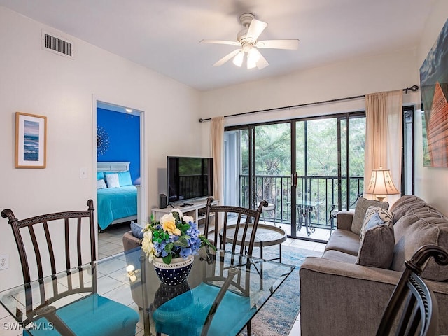 tiled living room featuring ceiling fan