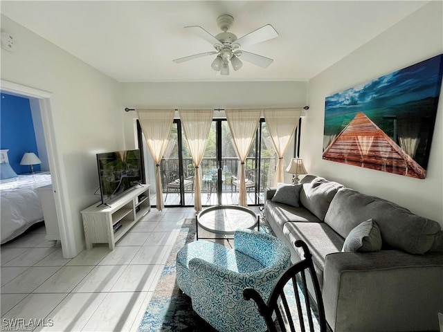 tiled living room with ceiling fan