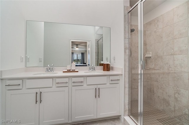 bathroom featuring vanity and a shower with door