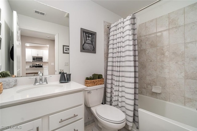 full bathroom featuring vanity, toilet, and shower / bath combo with shower curtain