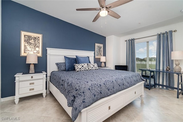 tiled bedroom with ceiling fan