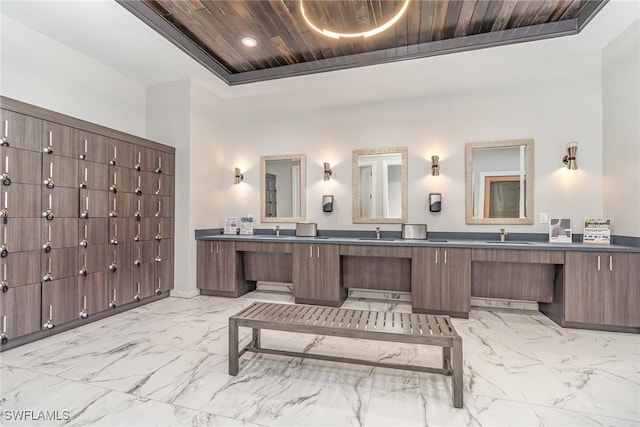 bathroom featuring vanity, wooden ceiling, and a raised ceiling