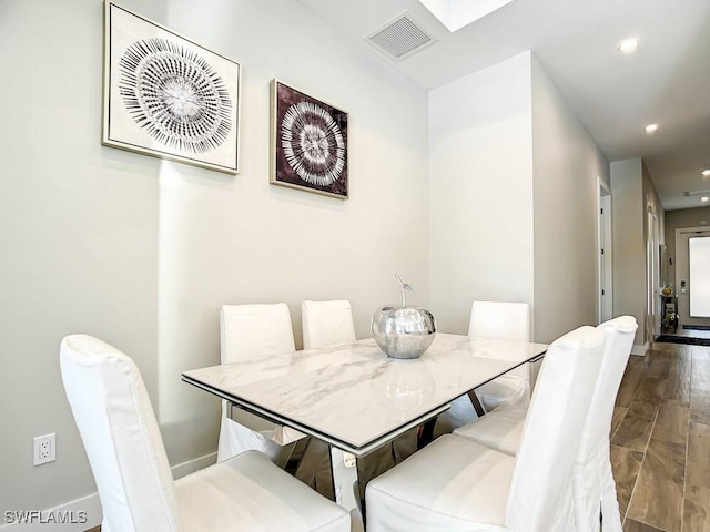 dining space featuring hardwood / wood-style floors