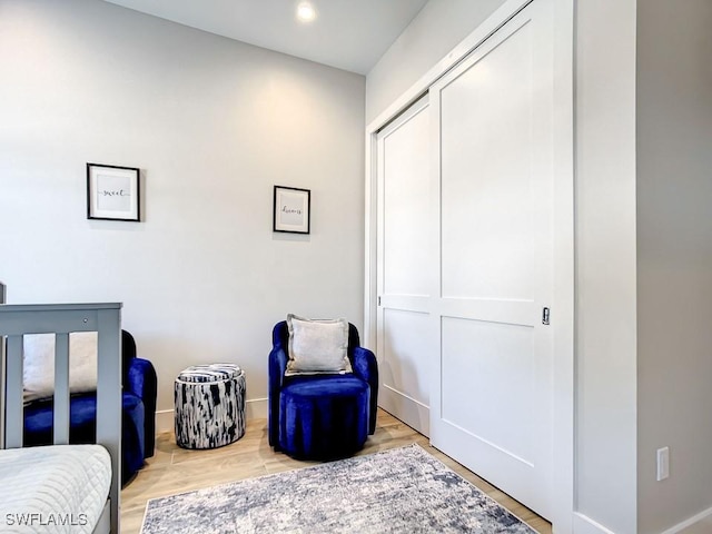 bedroom with a closet and light hardwood / wood-style flooring