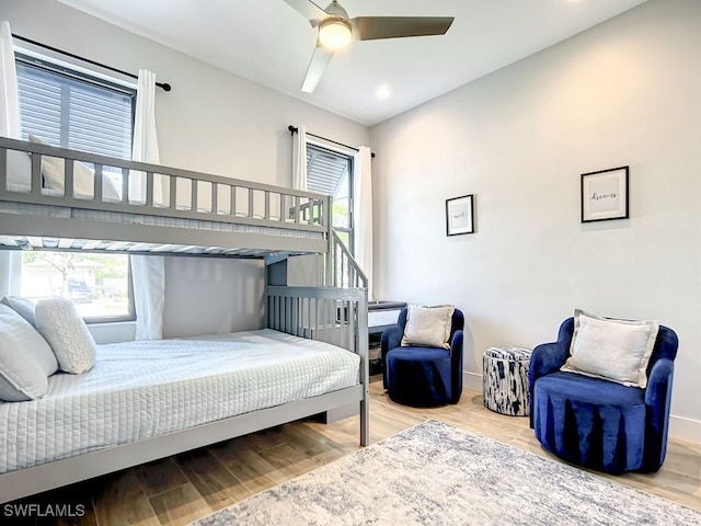 bedroom with wood-type flooring and ceiling fan