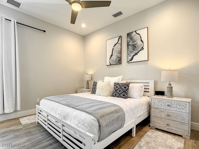 bedroom featuring hardwood / wood-style floors and ceiling fan