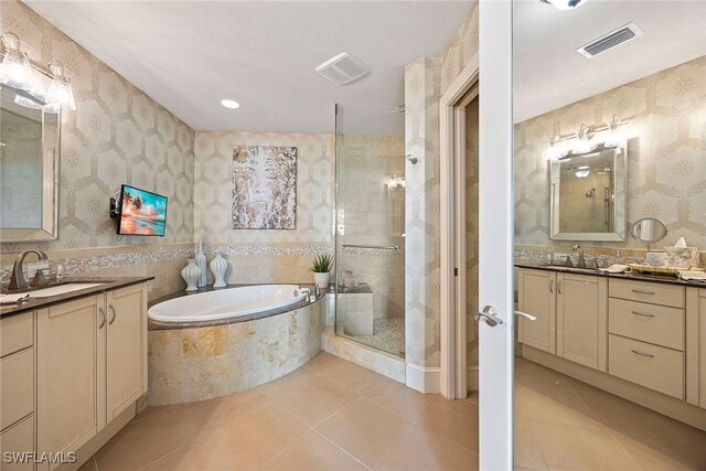 bathroom featuring vanity, tile patterned floors, and independent shower and bath