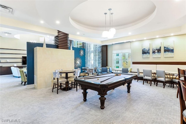 recreation room with light carpet, pool table, and a raised ceiling