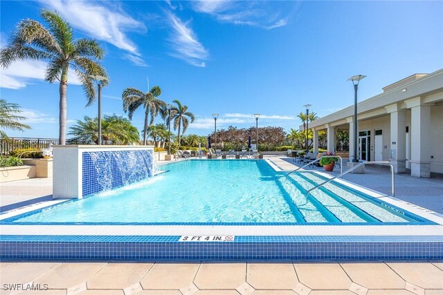 view of pool featuring a patio and pool water feature