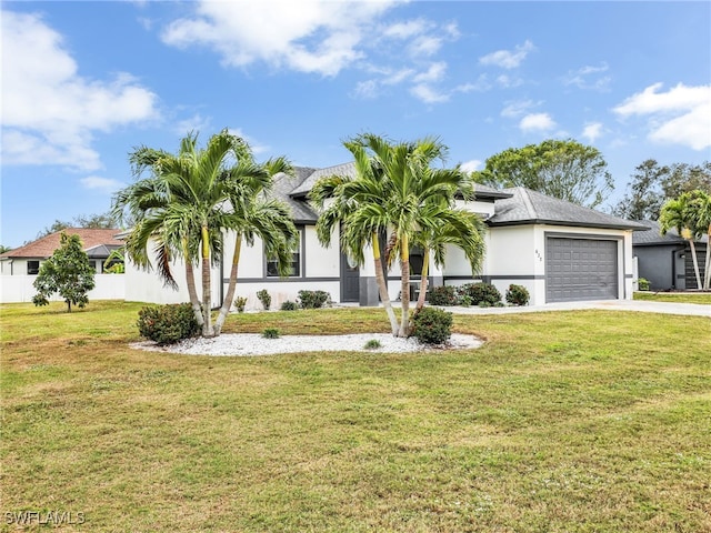 view of front facade featuring a garage and a front lawn