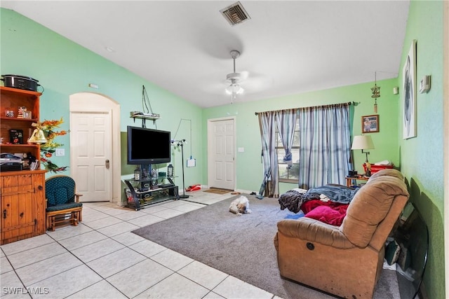 tiled living room with ceiling fan