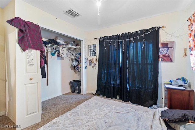 bedroom with carpet flooring and a closet