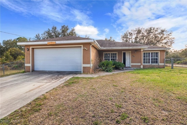 ranch-style house featuring a garage and a front yard